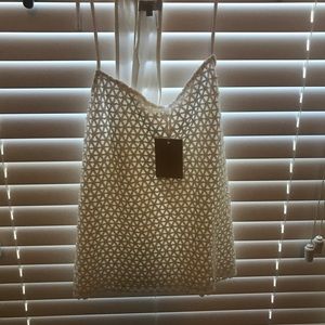 Never worn. White top.